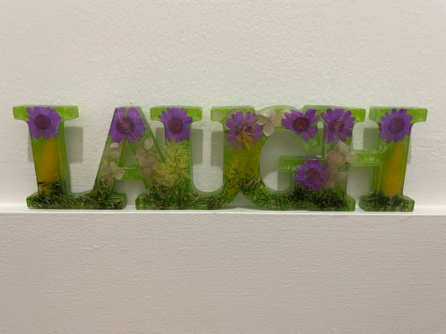 Resin “LAUGH” Signs
